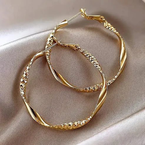 Gold-tone hoop earrings from the Earrings collection